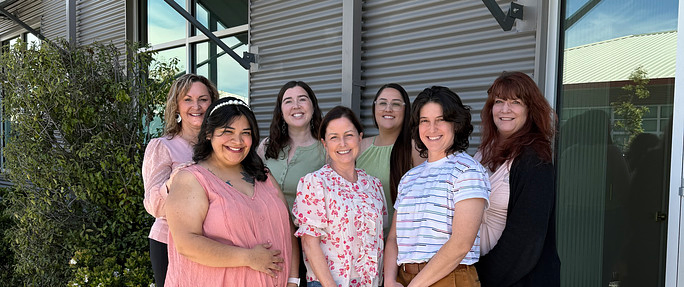 Dr. Amorteguy and her team pose for a photo in front of their San Luis Obispo dental practice