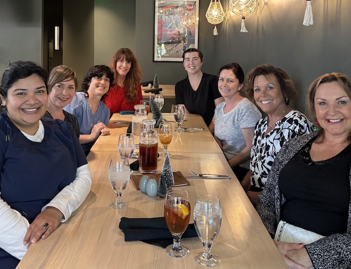 Dr. Amorteguy and her team pose for a photo in front of their San Luis Obispo dental practice